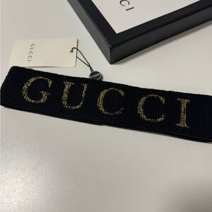 Gucci Black Headband with Gold Lettering